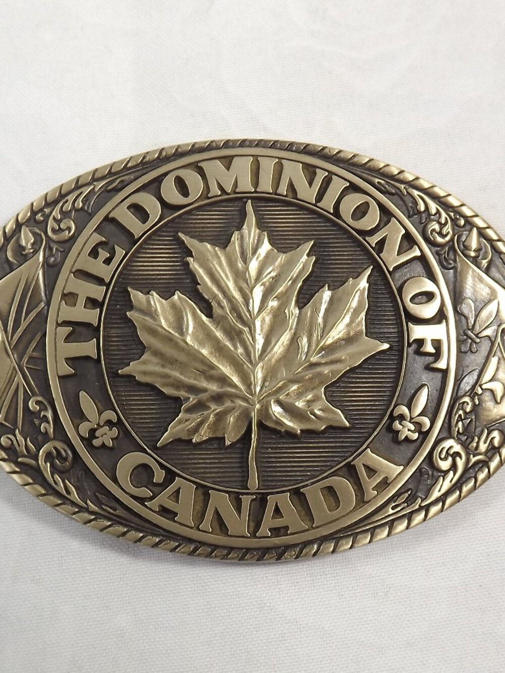 The Dominion of Canada Brass Maple Leaf Belt Buckle
